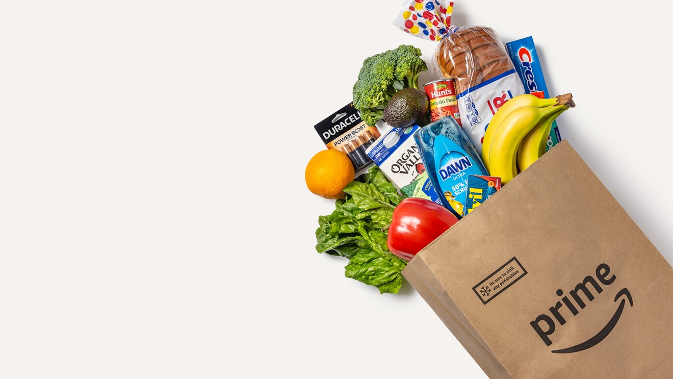 Amazon Prime grocery bag overflowing with fresh produce and household items