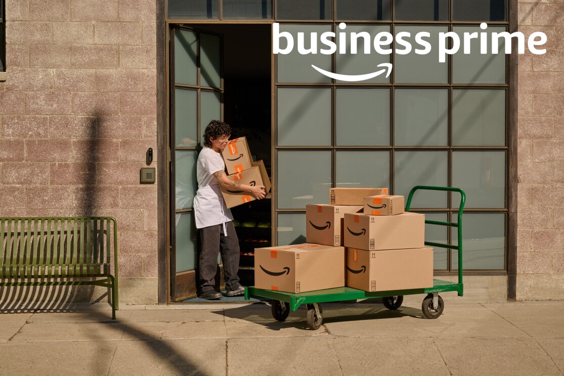 Employee handling Amazon deliveries at Business Prime storefront