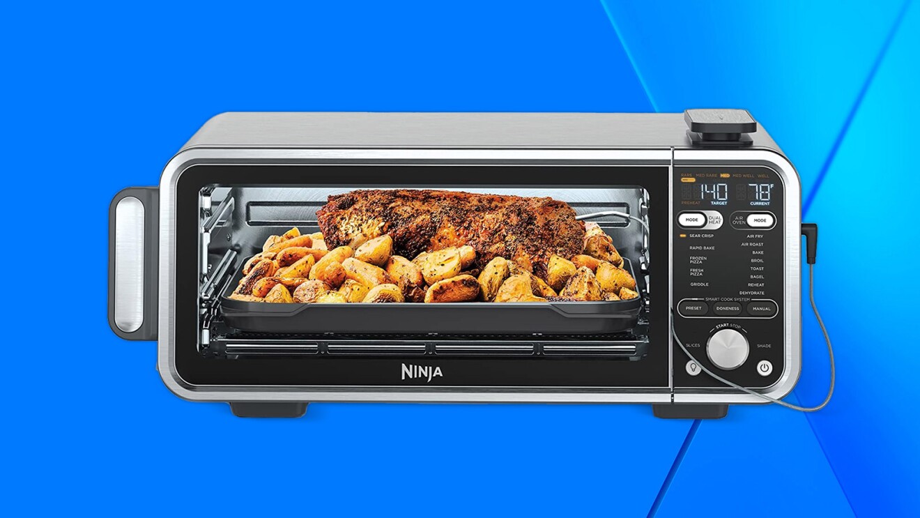 Ninja digital countertop oven cooking roast and potatoes