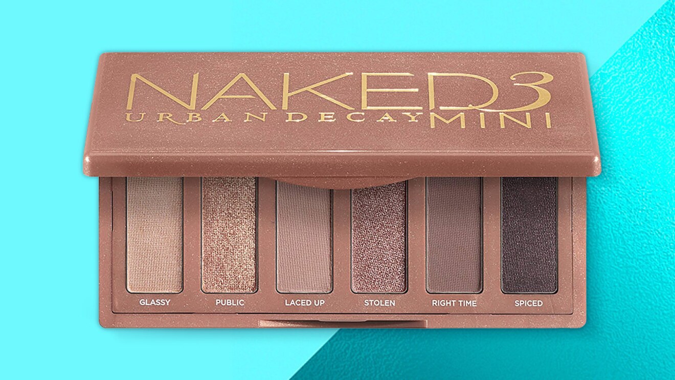 Urban Decay Naked3 Mini eyeshadow palette on teal background
