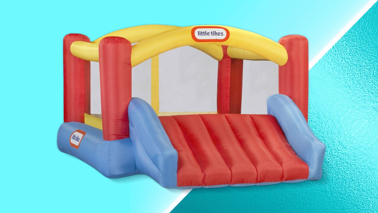 Colorful Little Tikes inflatable bounce house on blue background