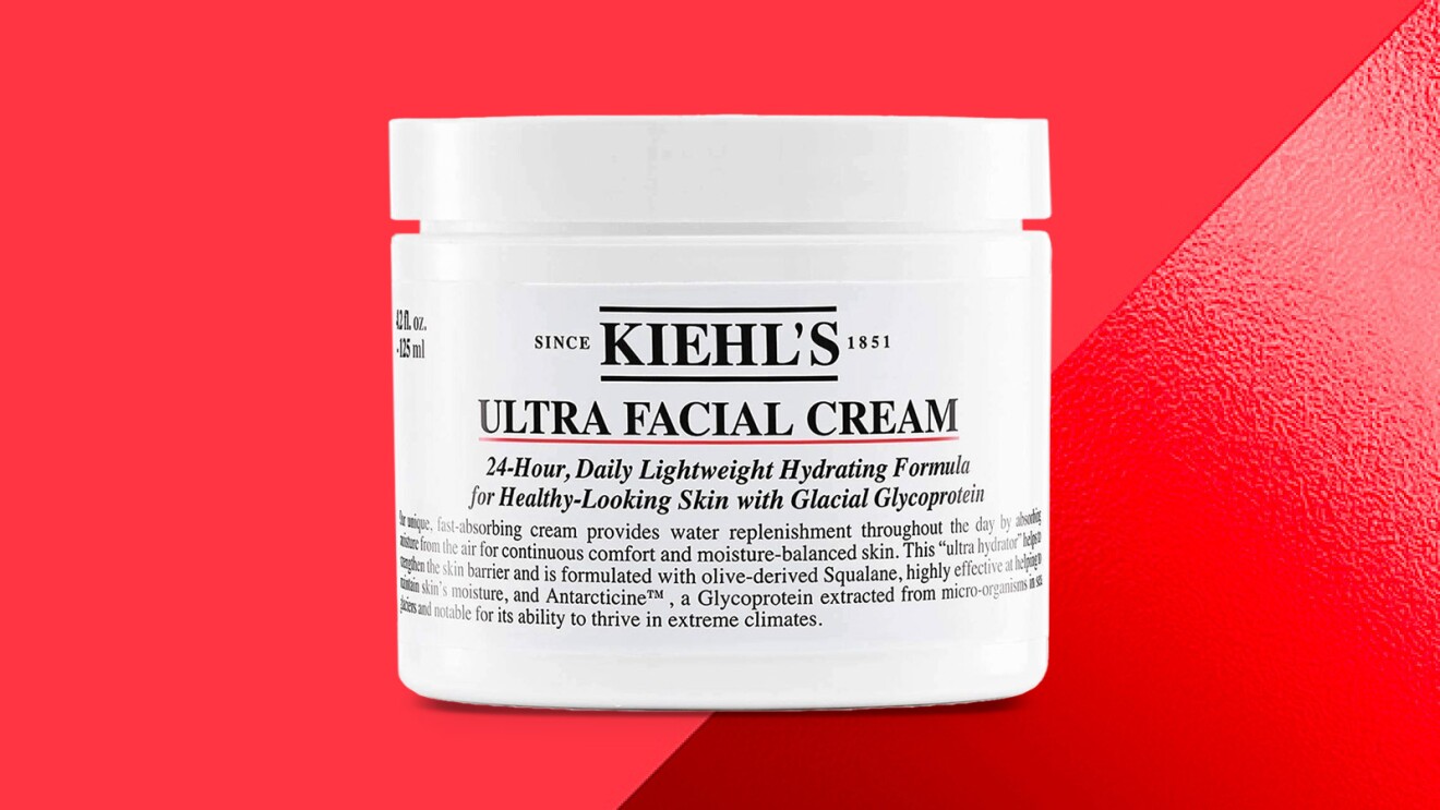 Kiehl's Ultra Facial Cream jar on red background