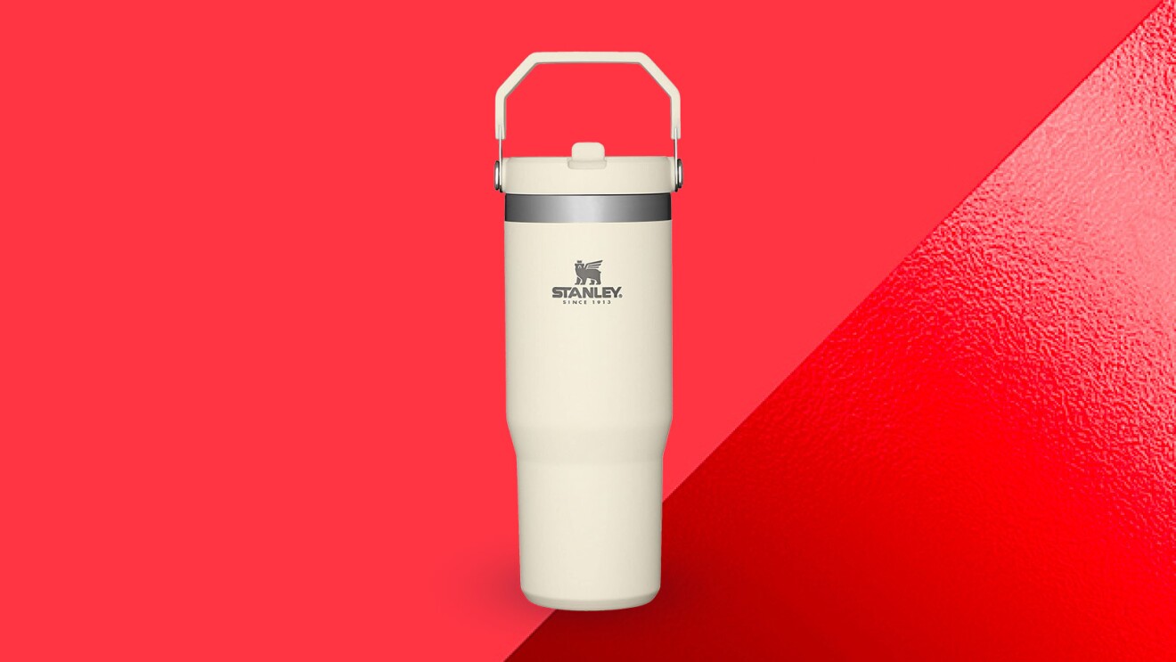 White Stanley insulated water bottle on vibrant red background