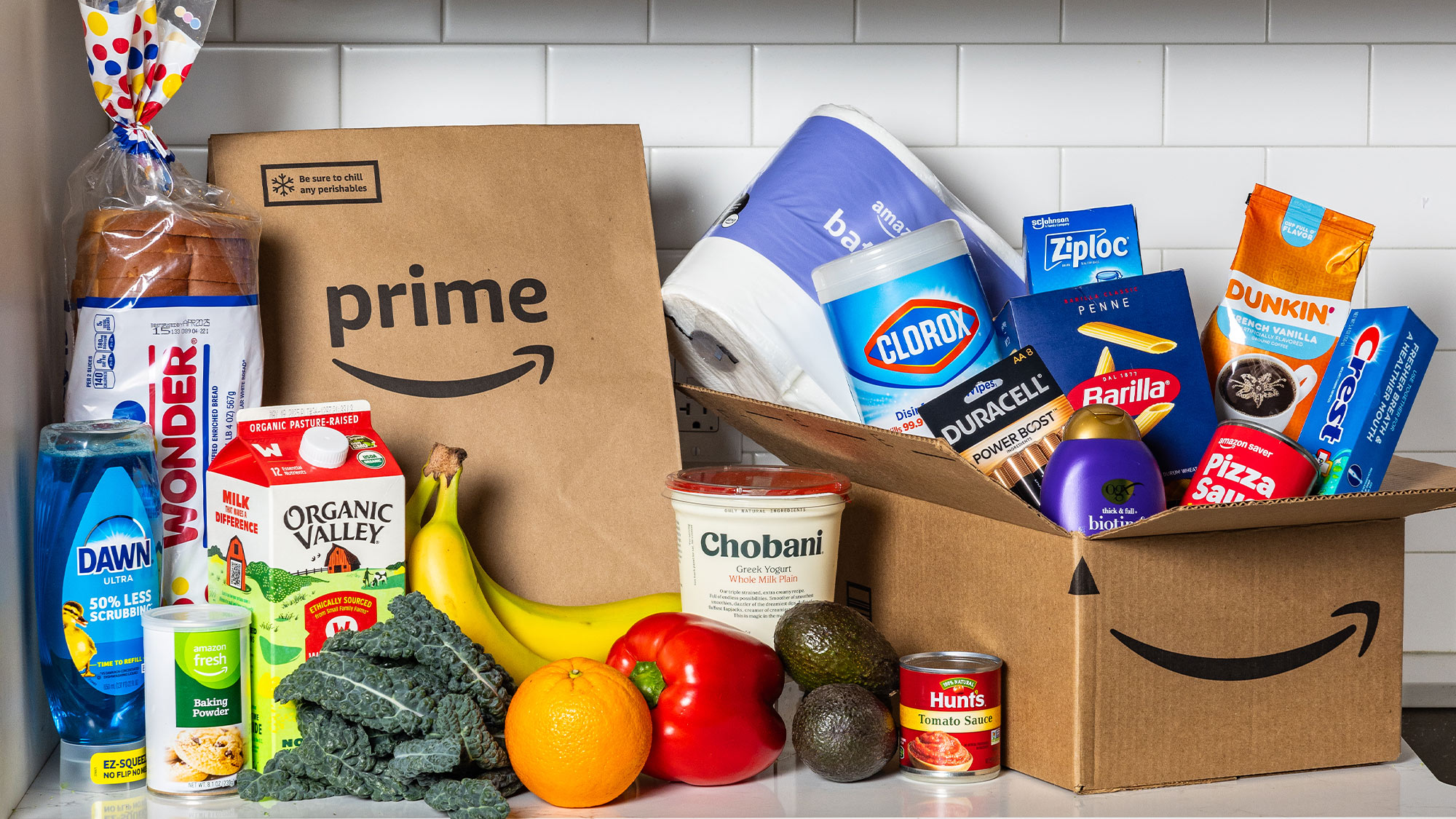 Amazon Prime delivery featuring food, cleaning supplies, and essentials